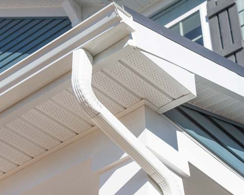 Storm damaged shingle with circled damage marks