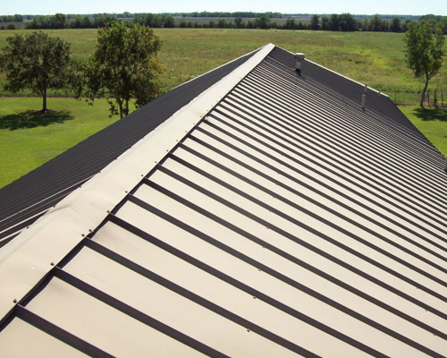 Brown metal tile roof with clean lines on residential home